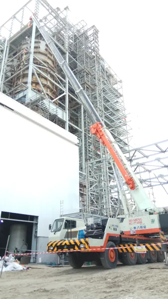 Large crawler crane lifting a boiler section at the Jimah power plant