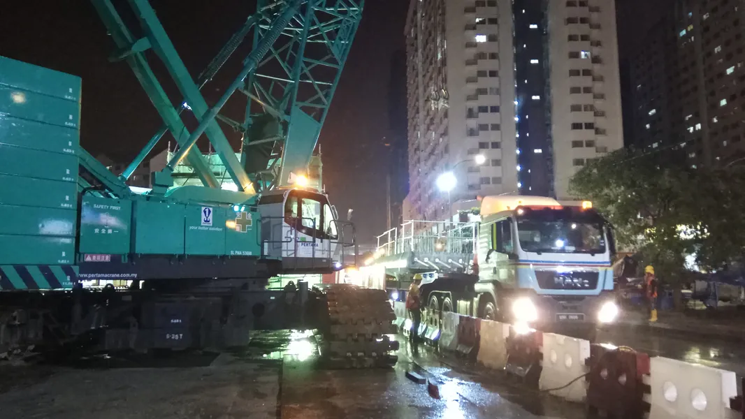 LRT3 pier cap lift with crawler crane and multi-axle trailer