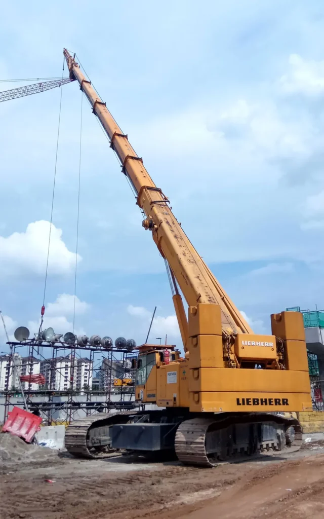 Yellow Pertama Crane telescopic mobile crane with boom extended on a construction site